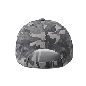 Detail view of the washed camo baseball cap featuring a premium adjustable metal buckle back