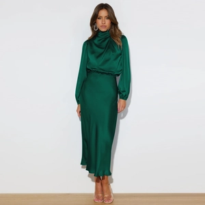 Elegant deep green satin halter neck dress with sophisticated draped silhouette