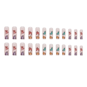Colorful summer glitter press-on nails with multi-color graffiti splashes on long coffin shape
