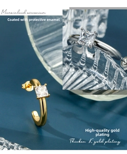 Detail of C-shaped hoop earrings featuring square zircon inlay and high-quality gold plating