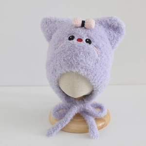Detail of purple plush cat hat for girls with 3D ears, bow, and soft chin straps