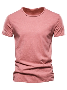 Close-up of men's pink slub cotton T-shirt showing fine fabric texture and round neck