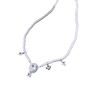 Elegant pearl necklace with crystal water drop pendant on a clean white background