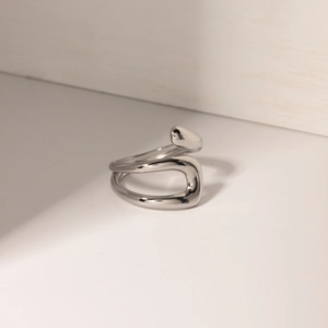 Polished silver stainless steel irregular open ring with a minimalist aesthetic design