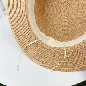 Detail of woven sun hat interior with adjustable sweatband and braided texture