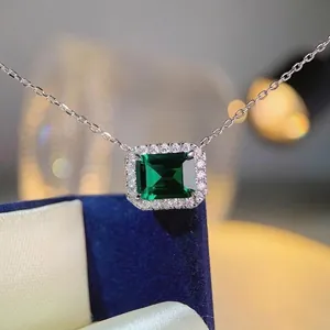Elegant S925 sterling silver necklace with emerald cut green gemstone in a velvet box