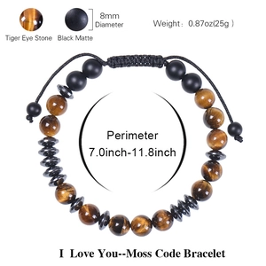 Morse code bracelet with 8mm tiger eye and matte black stones on a white background
