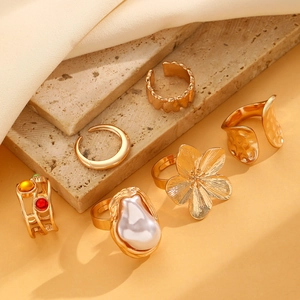 Detailed view of 6pcs gold vintage ring set with baroque pearl and colorful gemstones
