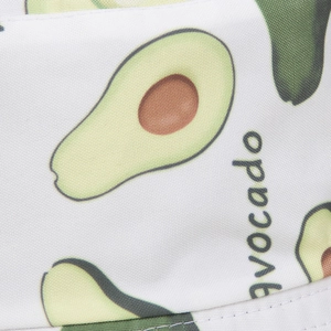 Close-up of white fabric sun hat featuring avocado prints and avocado typography