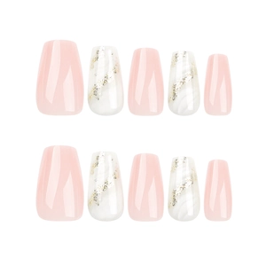 Pink and white ombre press-on nails with golden glitter ribbon details in coffin shape