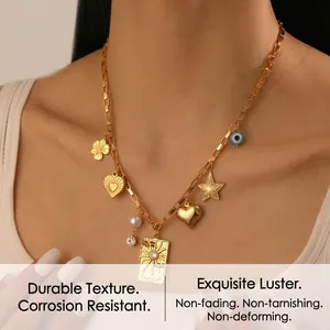 Detailed view of a gold multi-pendant necklace featuring celestial and heart charms