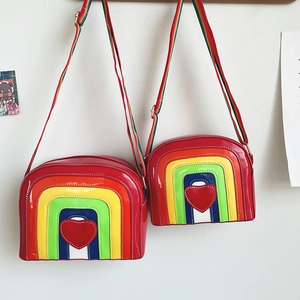 Detailed comparison of small and large rainbow heart crossbody bags with shiny finish
