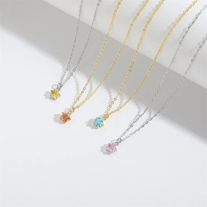 Minimalist five-pointed star pendant necklace available in gold and silver finishes