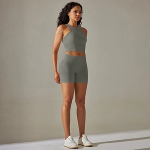 Detail of grey seamless ribbed sports set showing moisture-wicking fabric and high waist