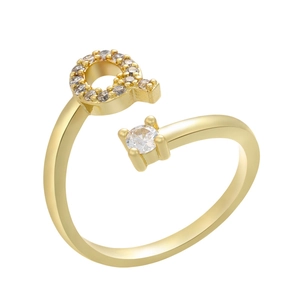 Detail of gold letter Q ring featuring micro-pave cubic zirconia and a round solitaire stone