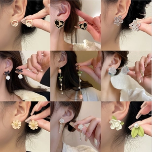 Collection of minimalist flower and heart stud earrings for women with pearl tassel accents