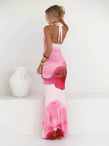 Sexy backless halter maxi dress with vibrant pink orchid print and slim fit style