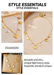 Detail view of golden necklace with heart, star, bow charms and baroque pearls