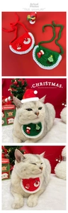 Detail of handmade crochet Christmas cat bibs in red and green with festive patterns