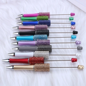 Detailed collection of colorful metal beadable pens with sparkling rhinestone accents
