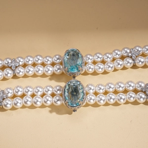 Double-layer pearl choker necklace with blue gemstone and star accents in retro style