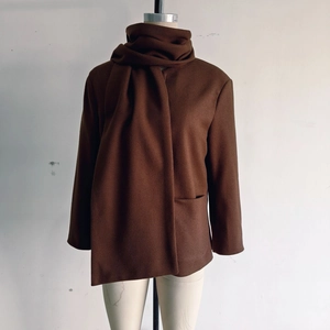Detail of coffee brown wool coat featuring a unique integrated scarf neck design