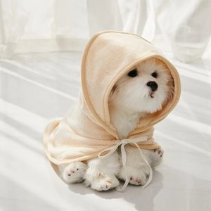 Detail of soft apricot microfiber pet hooded towel with a decorative white ribbon tie
