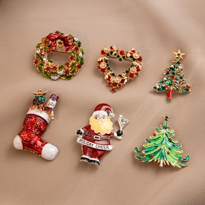 Close-up of 6-piece Christmas brooch set with colorful enamel and sparkling rhinestones
