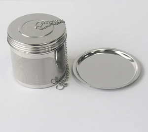 Detailed macro view of SUS 304 stainless steel tea infuser with chain and drip tray