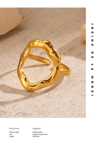 Macro shot of gold-plated stainless steel ring with irregular lava texture on stone