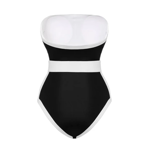 Detail view of one-piece swimsuit with black and white contrast piping and waist-slimming band