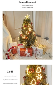 Detail of fiber optic Christmas tree with warm LED lights and red berry ornaments