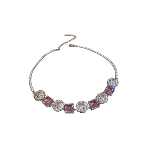 Silver necklace with pink square gemstones and zircon flower charms on white background