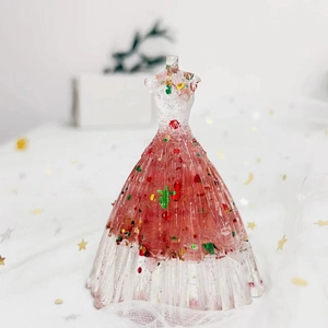 Macro view of crystal resin princess dress figurine with pink glitter and sequins