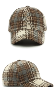 Detailed view of the vintage plaid wool texture and structured crown on this baseball cap