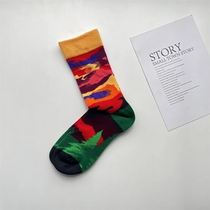 Detailed view of colorful jacquard cotton socks with artistic French illustration patterns