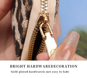 Close-up of durable gold-plated zipper and hardware on leopard print card holder wallet