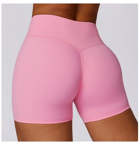 Detail of high waist hot pink yoga shorts with V-shaped back seam for butt lifting