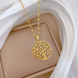Macro detail of golden Tree of Life necklace pendant with sparkling zircon stones