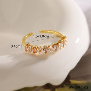 Macro detail of 18K gold plated ring featuring alternating pearls and yellow crystals