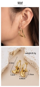 Detailed view of gold irregular heart and crescent earrings with dimensions and weight