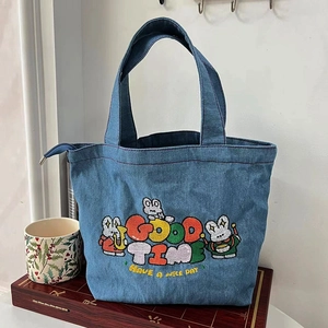 Japanese style denim tote bag with cute cartoon embroidery on wooden chessboard