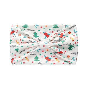 Close-up of white festive headband with colorful Christmas tree and star patterns
