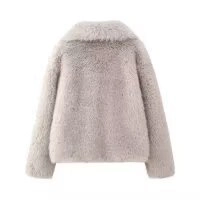 Back view of a short faux fur jacket in light grey showing plush texture on white background
