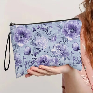 Trousse à maquillage bleue à fleurs avec fermeture éclair et dragonne pour le voyage