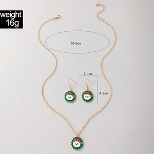 Detailed view of Santa Claus enamel jewelry set with green charms and dimensions