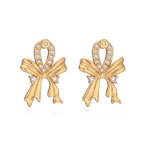 18K gold plated bow earrings with sparkling cubic zirconia on a white background