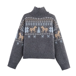 Detailed view of the vintage jacquard knit pattern with horses and snowflakes on grey sweater