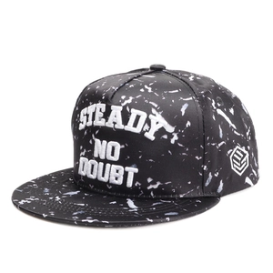 Detail of 3D embroidery and marble pattern texture on a black snapback hip hop cap