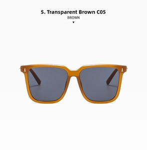 Close-up of transparent brown square frame sunglasses with metal hinge detail and dark lenses